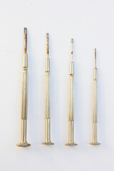 A set of four precision screwdrivers. These tools are typically used for small or delicate screwing tasks, such as repairing electronics or eyeglasses.