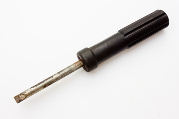 A Flat Head (or Slotted Head) Screwdriver is a type of screwdriver characterized by its wedge-shaped flat tip, which is designed to fit into the linear, straight notch on the head of a slotted screw.