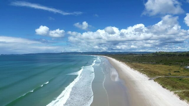 4K drone footage. Flying over white sands of Langs Beach, Whangarei, New Zealand.
