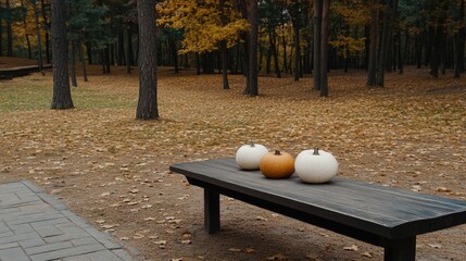 A rustic wooden table holds a colorful assortment of pumpkins and vegetables amidst a picturesque autumn forest backdrop, offering ample space for text related to the season.