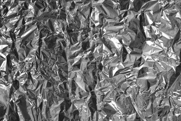 Processed collage of shiny metal silver gray foil crumpled packaging material texture