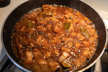 Braised pork in a pan.