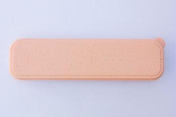 A pink rectangular box. This box can be used to store cutlery, stationery, etc.