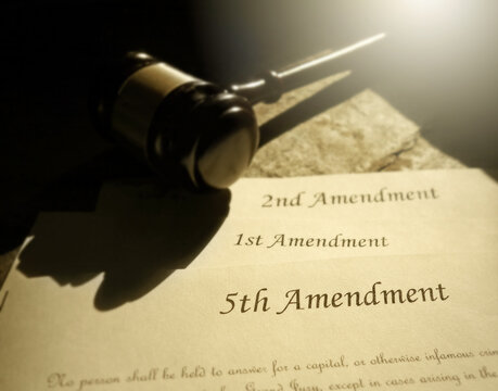 First, Second and Fifth Amendments to the US Constitution and court gavel -- civil liberties concept