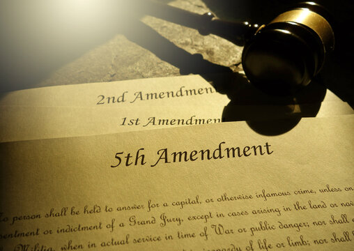 First, Second and Fifth Amendments to the US Constitution and court gavel -- civil liberties concept