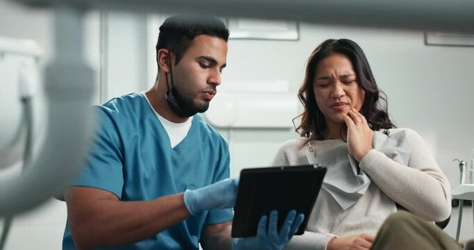 Tablet, doctor and woman for dentist appointment, results and feedback in hospital or oral care clinic. People, discussion and dental hygienist on tech for teeth decay, diagnosis and tooth extraction