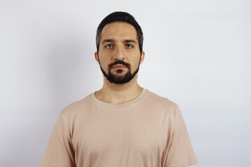 Male portrait on white background. Man in a T-shirt