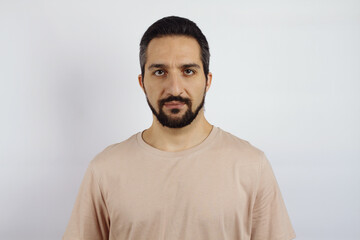 Male portrait on white background. Man in a T-shirt