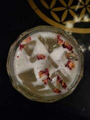 cocktail with rose petals on top
