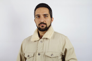 Portrait of a man in a warm white jacket on a white background