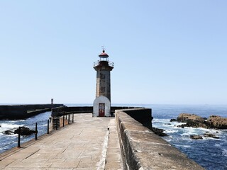 Lighthouse on the shore of the Atlantic Ocean. Portugal.
