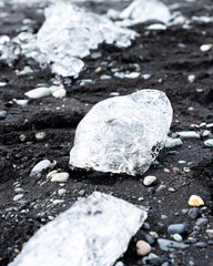 Ice of J&ouml;kuls&aacute;rl&oacute;n Glacier Ice on black Sand, Diamond Beach, Iceland