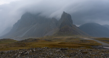 Mystic mountains with storm clouds at Hvalnes lighthouse, Iceland
