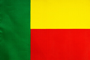 National flag of the state of Benin close-up. State background.