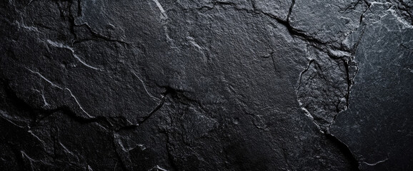 Dark black slate background texture showing rough surface