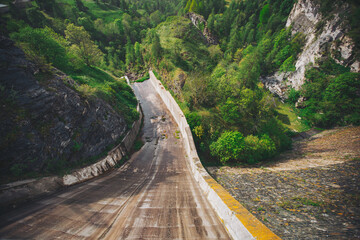 Dike at Pontechianale in Val Varaita, Italy, 2023. Wall of the dike at Pontechianale. 