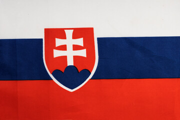 National flag of the state of Slovakia close-up. State background.