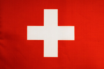 National flag of the state of Switzerland close-up. State background.
