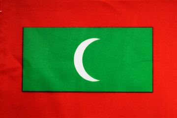 National flag of the state of Maldives close-up. State background.