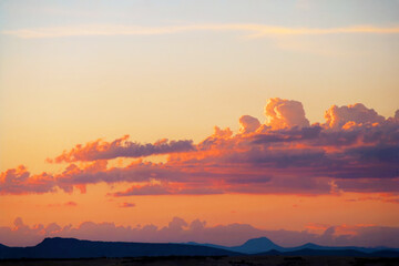 Monsoon clouds over Prescott Arizona USA at sunset create a beautiful orange glow