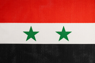 National flag of the state of Syria close-up. State background.