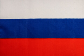 National flag of the state of Russia close-up. State background.