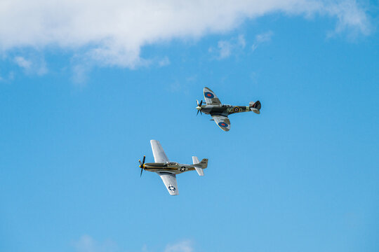 Sola, Norway - June 16 2024: Vickers Supermarine Spitfire Mk XVI and North American P-51D Mustang performing a display.