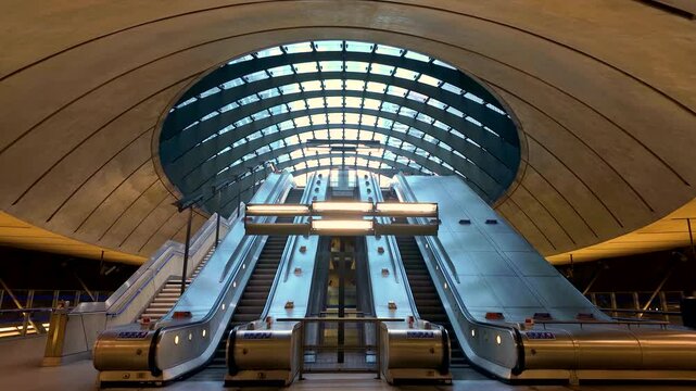 Time lapse view of commuters at escalators in a underground station in London, England