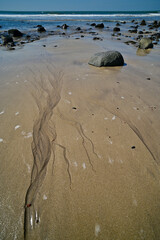 Patterns in sand on Kashid beach, India. 
