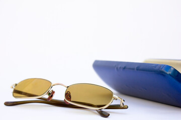 A sophisticated aviator sunglasses with a thin metallic frame, exuding a luxurious vibe. The...