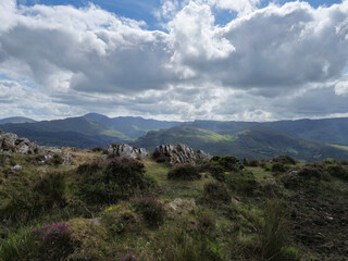 Green hills under blue summer sky landscape in Ireland