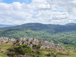 Green hills under blue summer sky landscape in Ireland