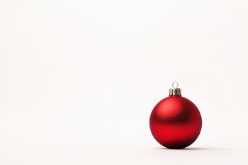 Red Christmas ball on white with copy space