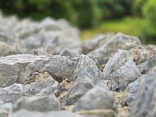 Stones pile close macro view with blurred bokeh background