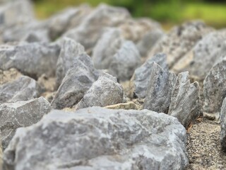 Stones pile close macro view with blurred bokeh background