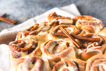Traditional swedish cinnamon rolls on gray background, close-up
