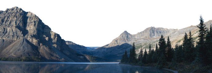 A large rocky mountain in the background with a glacier and a calm blue lake in the foreground. A treed shoreline fills the right side of the frame. The sky is transparent
