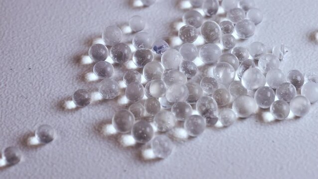 Plastic pellets or nurdles symbolizing microplastic pollution and environmental contamination. Suitable for raising awareness about environmental issues, sustainability, pollution, and recycling
