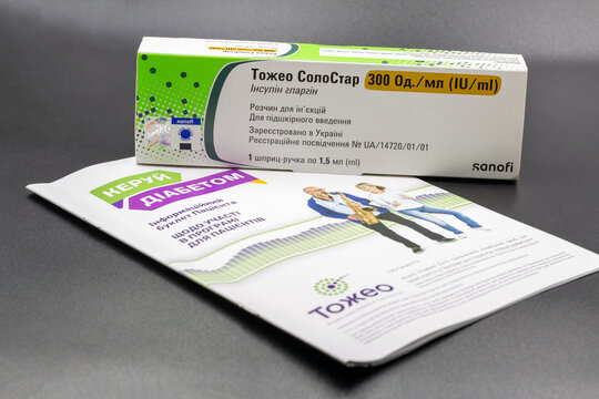 Sanofi Toujeo SoloStar insulin pen injection package closeup on black.