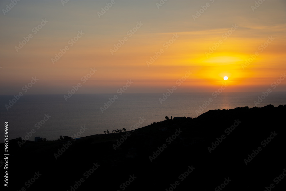 Wall mural sunset over the sea