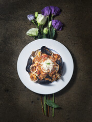 Seafood pasta dishes and flowers.
