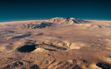 Desert landscape with crater. Aerial view of a vast desert landscape with a prominent mountain range and a large crater. The image evokes a sense of isolation and vastness.