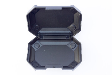 Durable Protection: Black Plastic Case. A robust black plastic case with a secure hinged lid,...