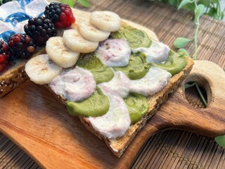 Greek yoghurt mixed blue almond peanut butter toast with blackberries and greek yoghurt matcha...