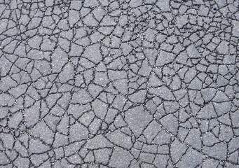 Old city road image - grey cracked asphalt texture in Vienna, Austria, Europe