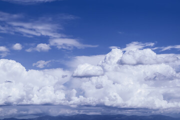 Madrid’s Serene Skyline: Fluffy Cumulus Clouds Adorning the Blue