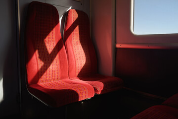 Empty red seats in a train