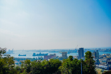 Kaohsiung, Taiwan, Republic of China, 01 25 2024: The landscape of Kaosiung port harbor, downtown, taiwan strait, and shoushan mountain 