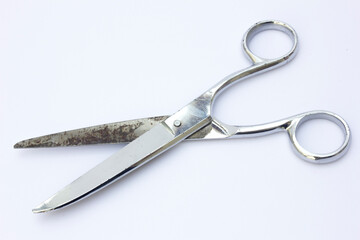 Fototapeta premium Precision Fabric Scissors, a close-up of sharp, stainless steel blades designed specifically for cutting fabric. The ergonomic handles ensure comfortable use during sewing and crafting projects.