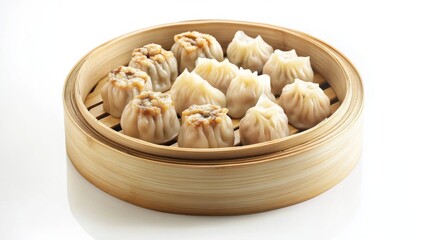A traditional dim sum platter featuring steamed siu mai and fluffy bao buns, arranged elegantly on a bamboo steamer with a clean, white background.